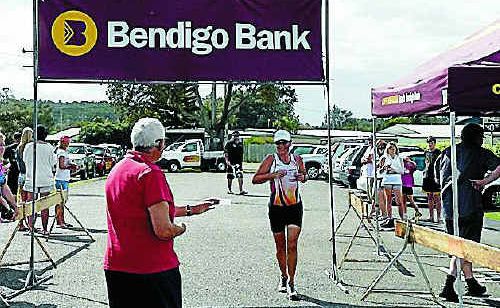 Overall female champion Melissa Bulloch crosses the finish line in the Bendigo Bank Easter Triathlon. Overall female champion Melissa Bulloch crosses the finish line in the Bendigo Bank Easter Triathlon.